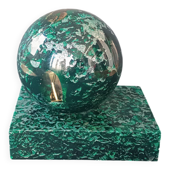 Design bookends in fractal resin with watchmaking inclusions.