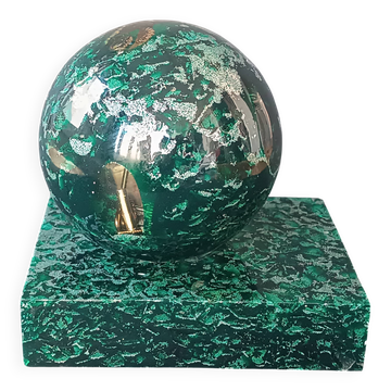 Design bookends in fractal resin with watchmaking inclusions.