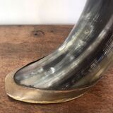 Polished beef horn on brass base