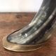 Polished beef horn on brass base