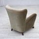 Fauteuil danois des années 1960, velours vert, pieds en bois de chêne.