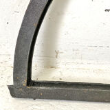 Old arched anthracite grey window