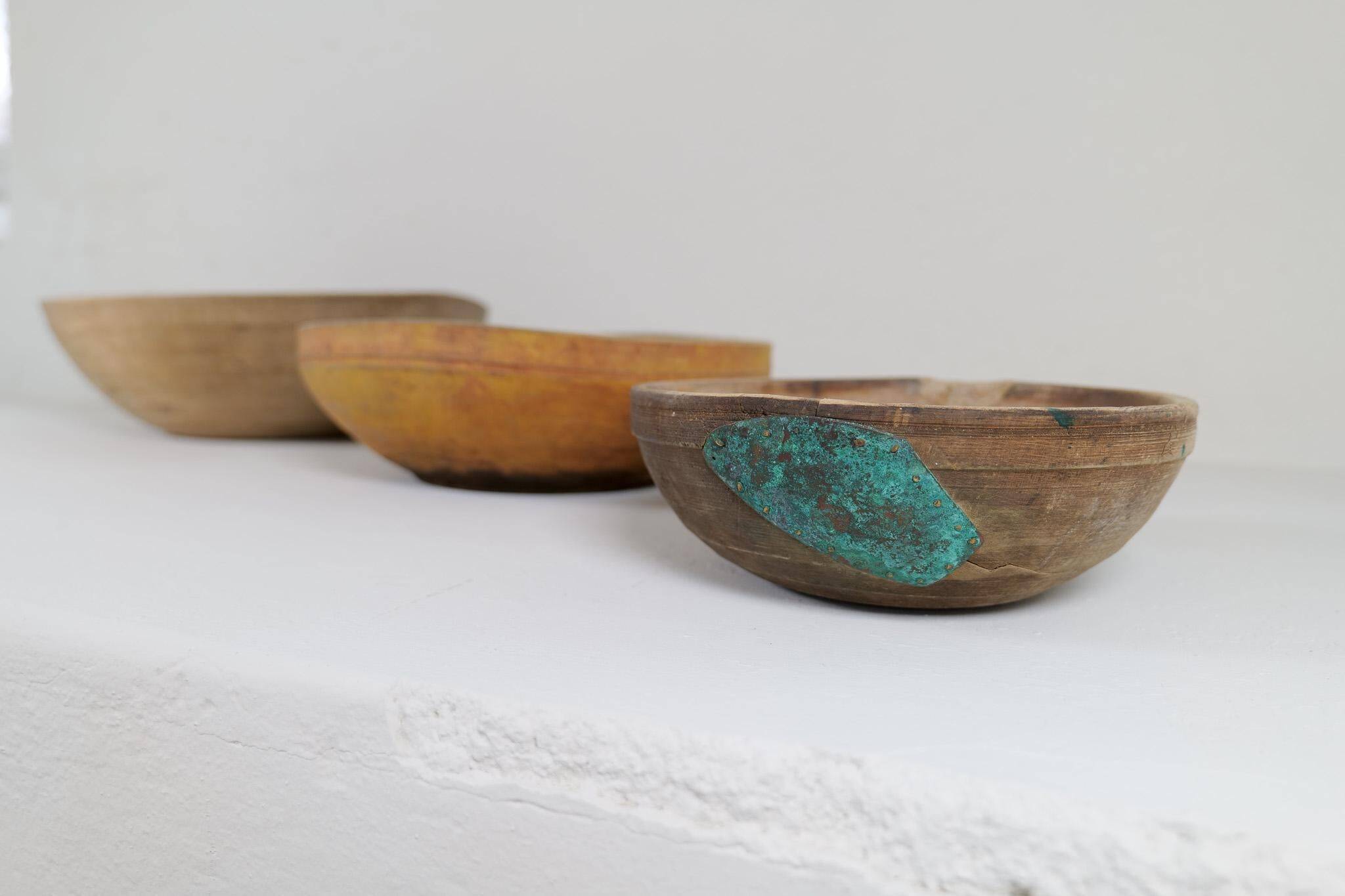Set of three unique farmhouse bowls from 19th-century Swedish folk art.
