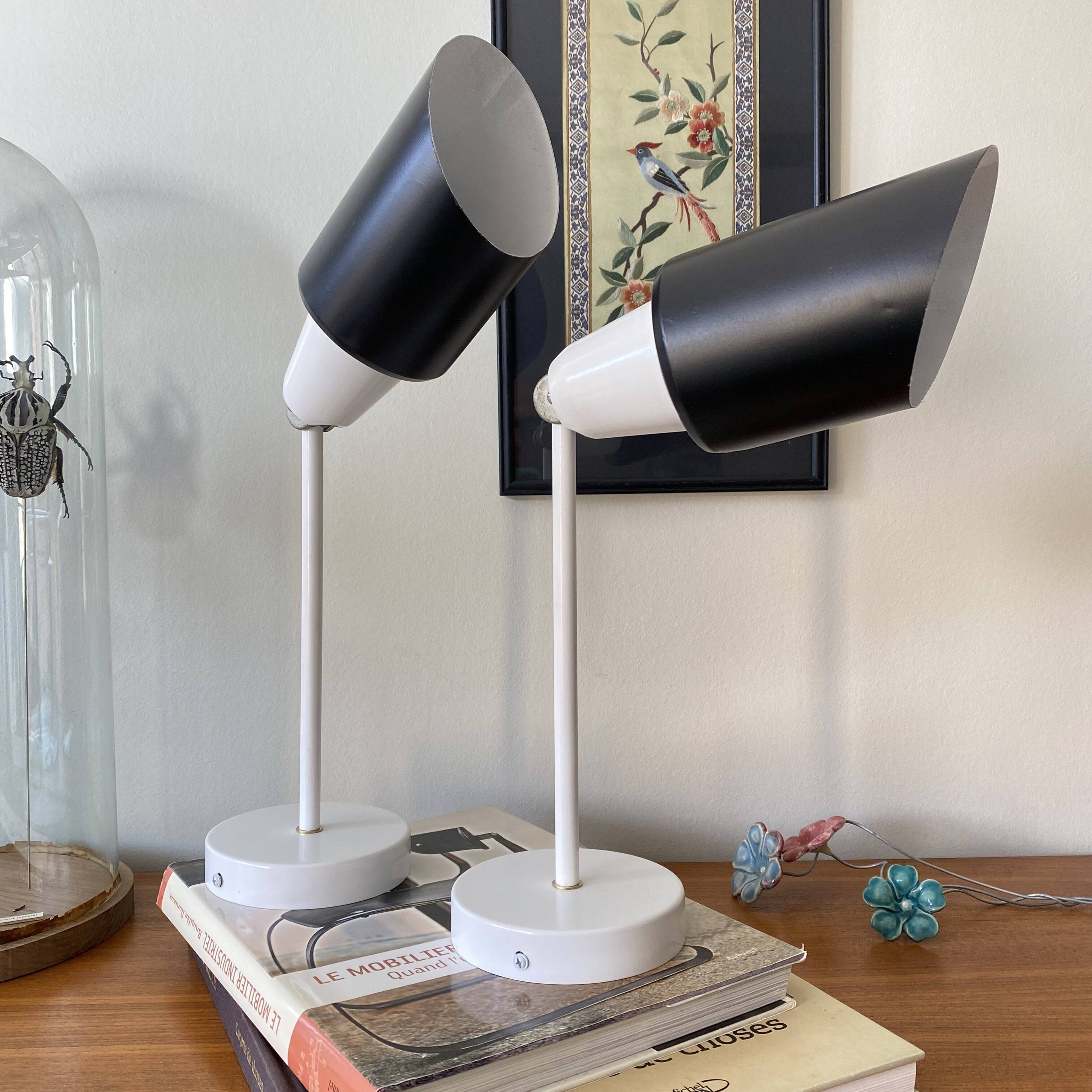 Pair of adjustable industrial metal wall sconces.