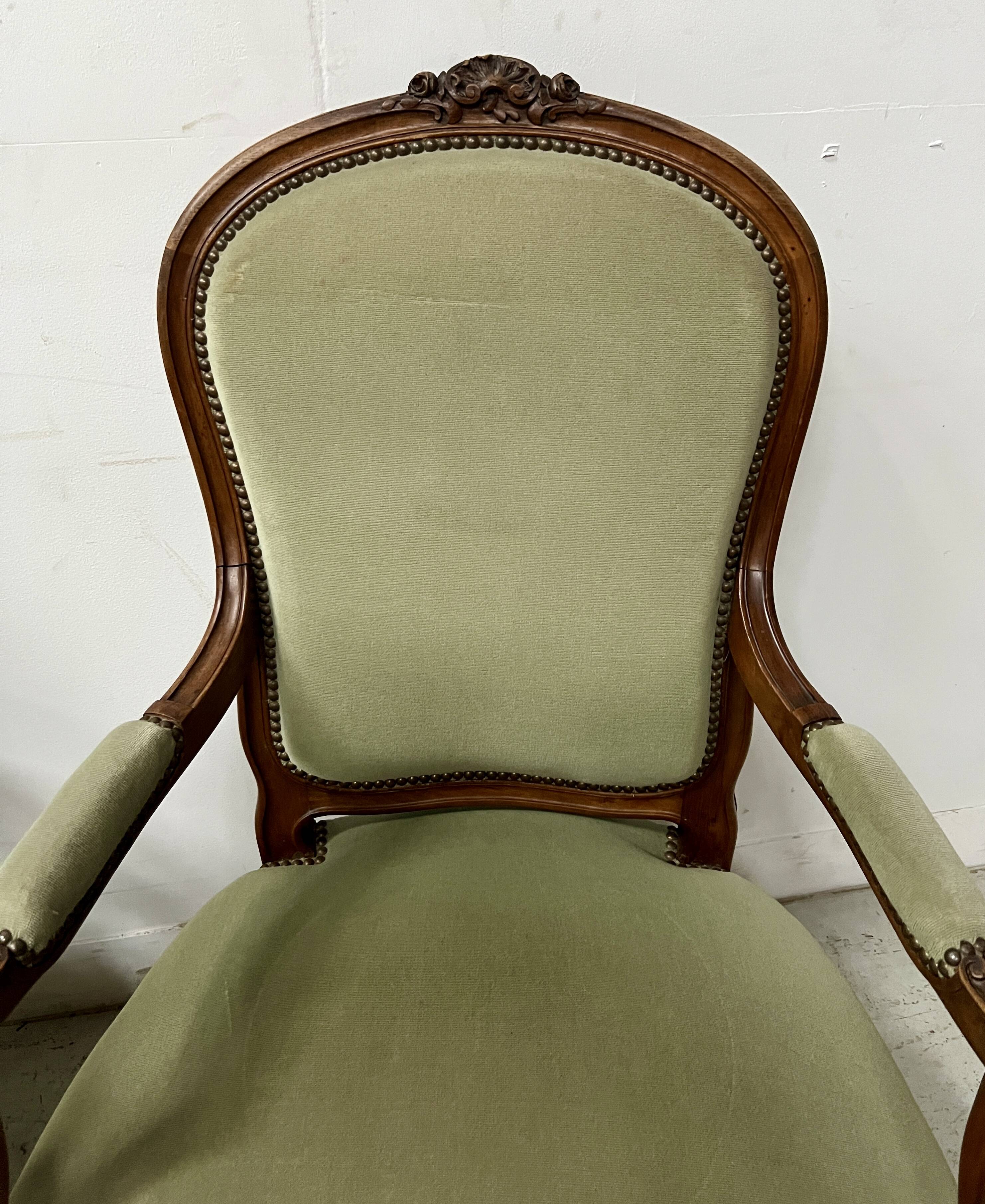 Pair of Louis XV style armchairs in solid walnut, 20th century.