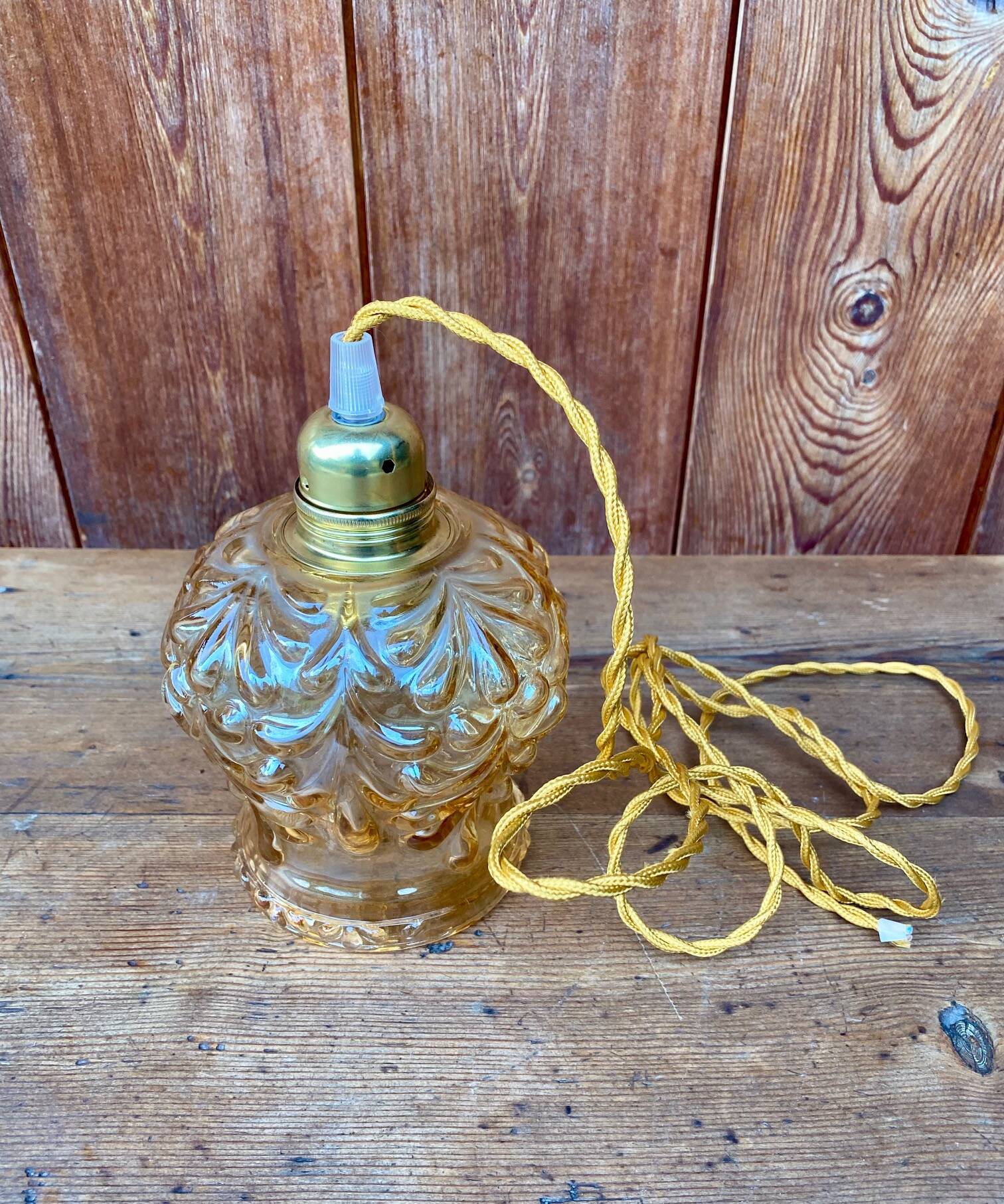 Vintage cut amber glass suspension globe.