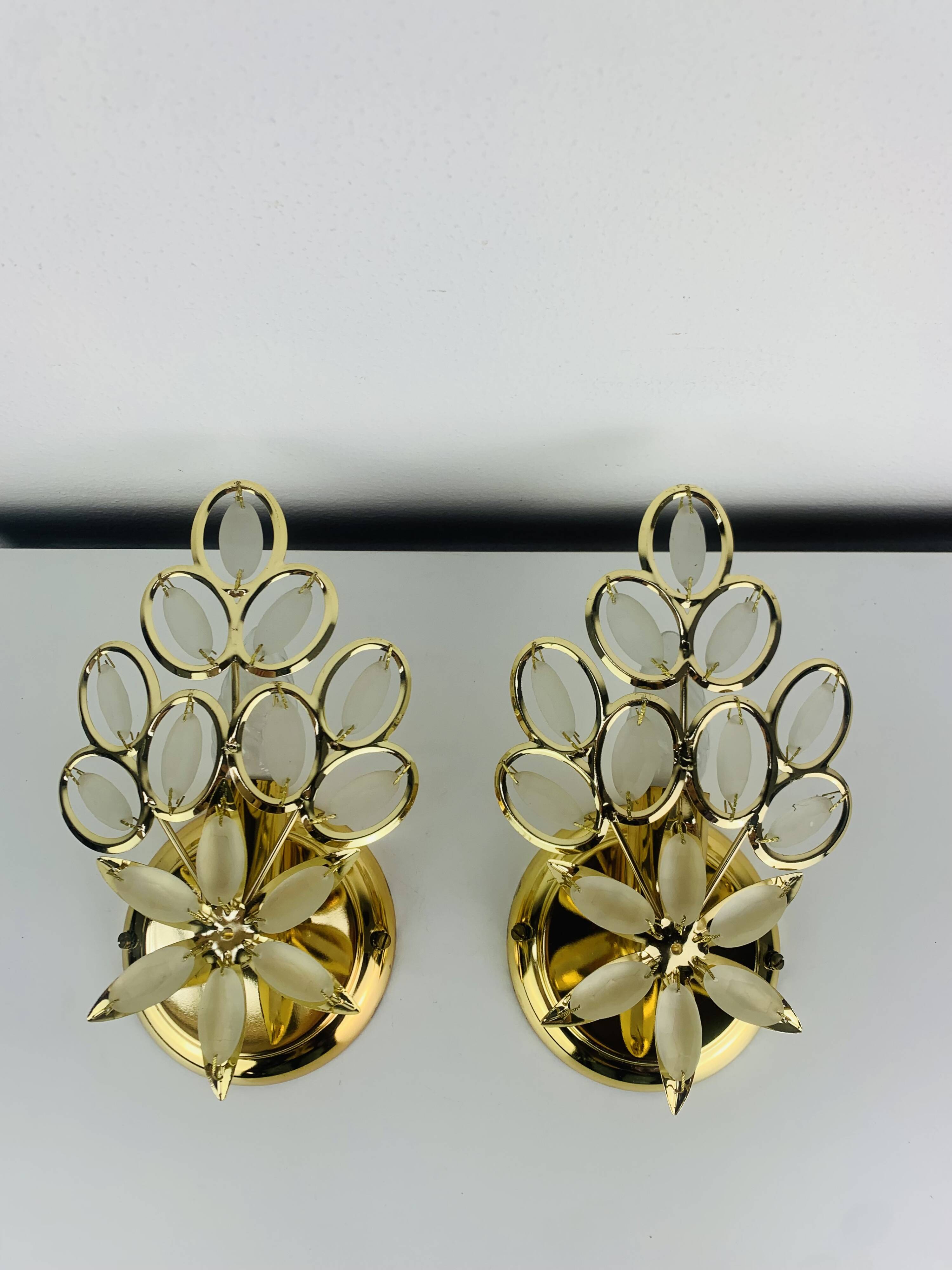 Pair of Hollywood Regency wall lights with glass and gold metal pendants Mathias