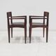Set of six Italian wooden dining chairs in dark brown faux leather.