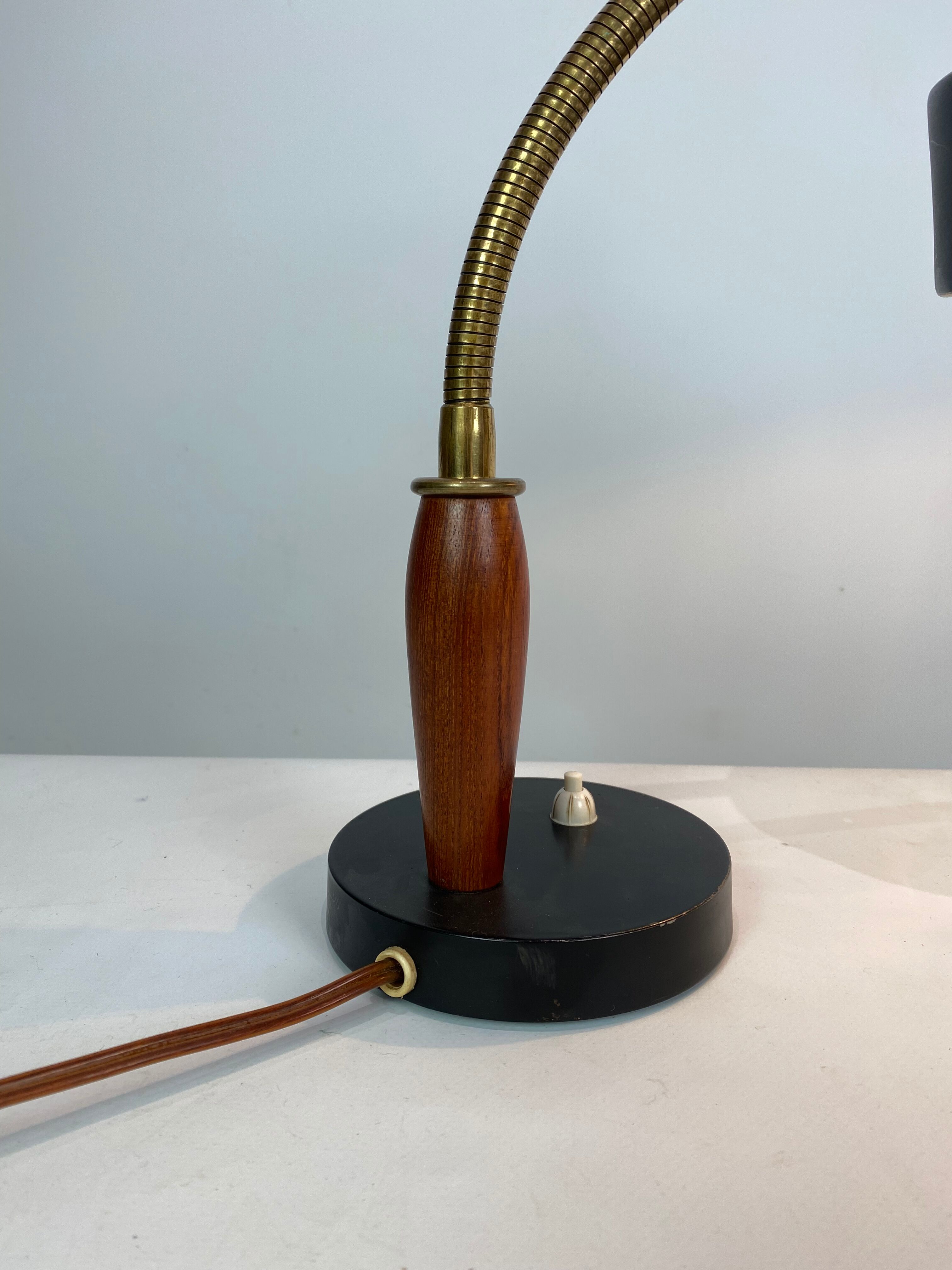 Table lamp of black metal and teak of Danish design, 1960s