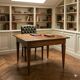Antique Directoire table in walnut and cherry, Italy, 19th century.