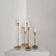 Gunnar Ander, four candlesticks, brass and glass, Ystad Metall, Swedish modern.