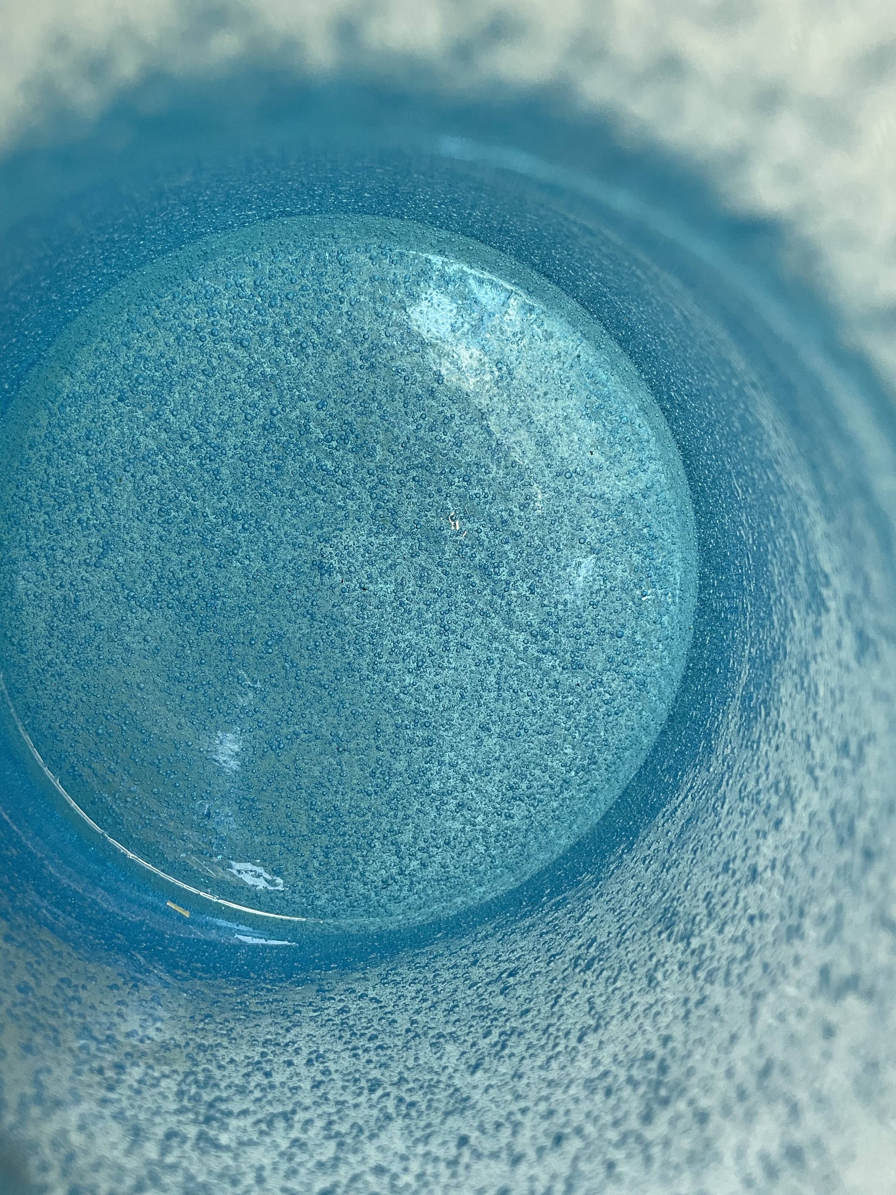 Blue glass vase with encrusted bubbles