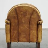 Unique children’s armchair made of cowhide leather in Art Deco style, featuring a light cognac color