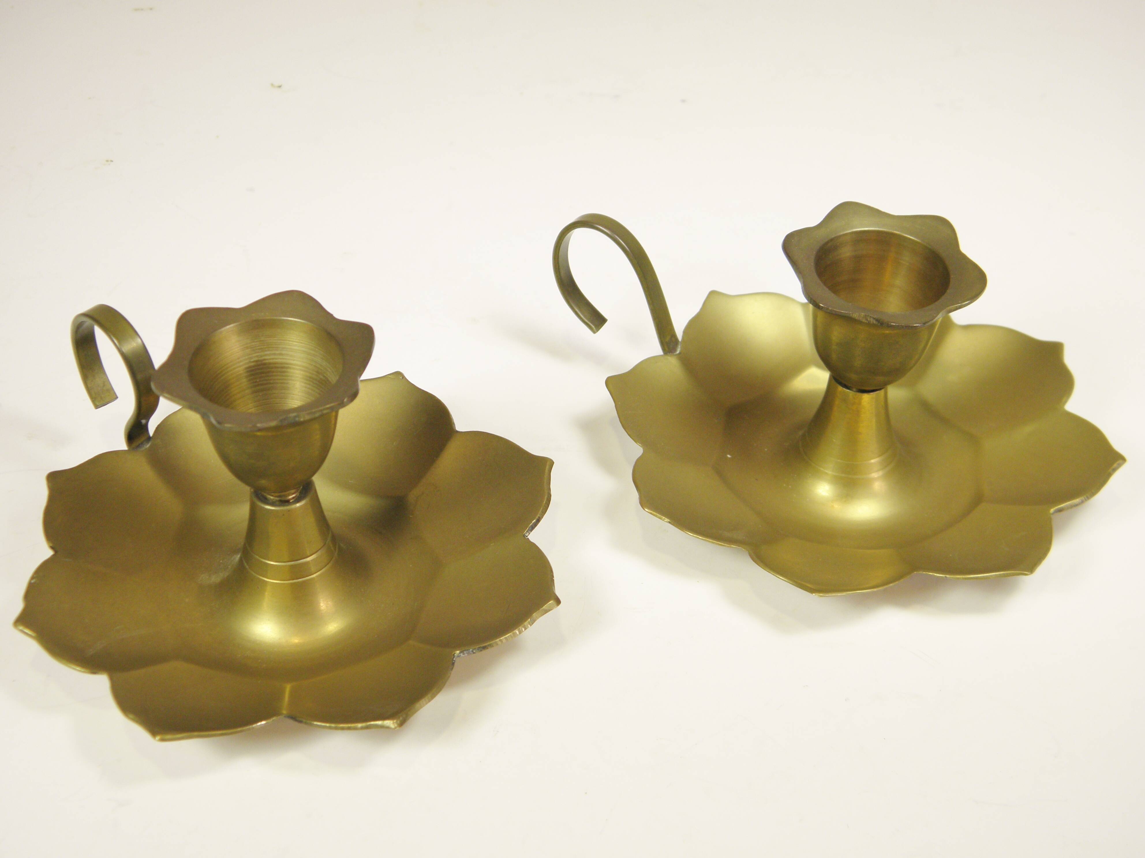 Pair of brass "flower" candlesticks