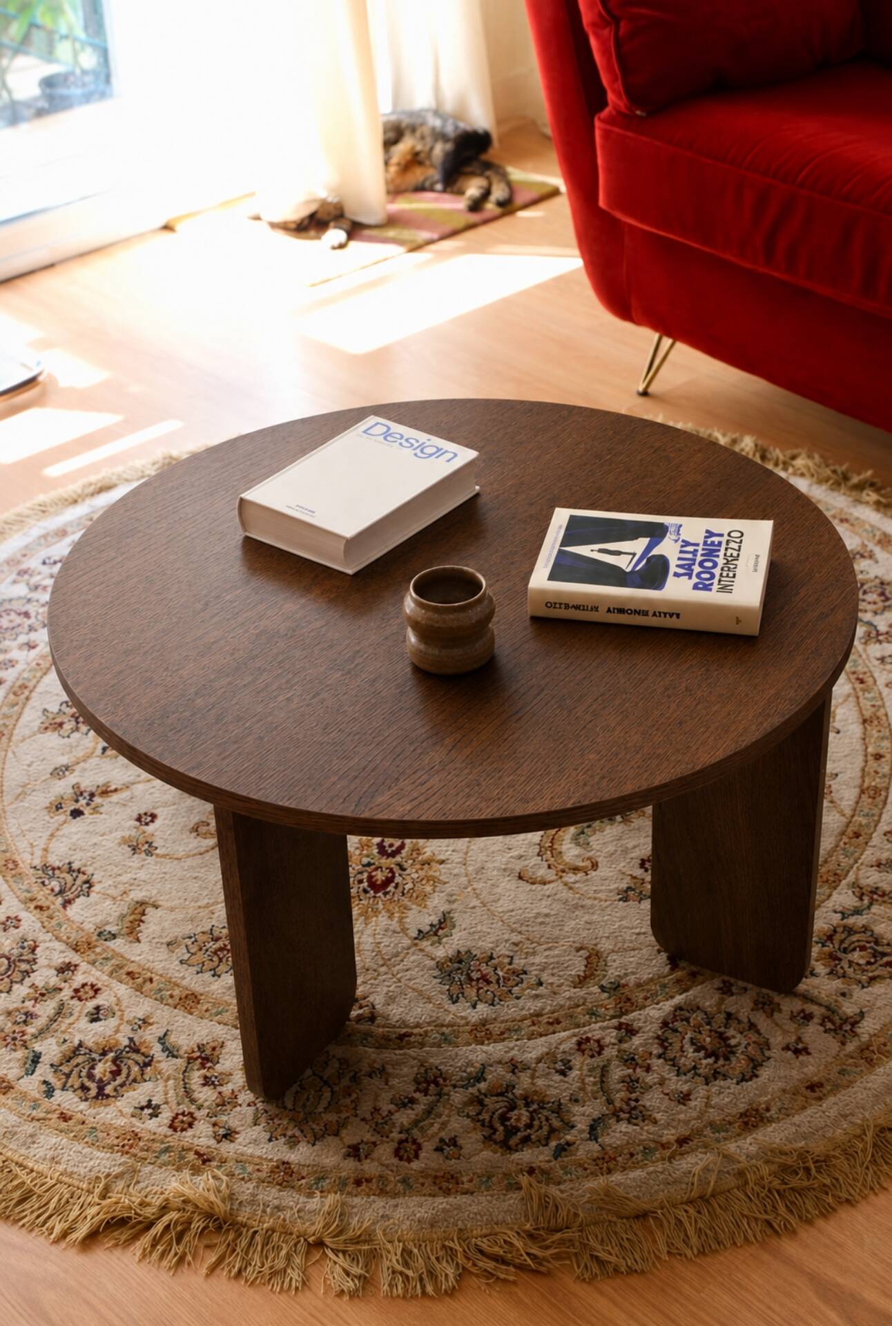 Round table in dark oak veneer