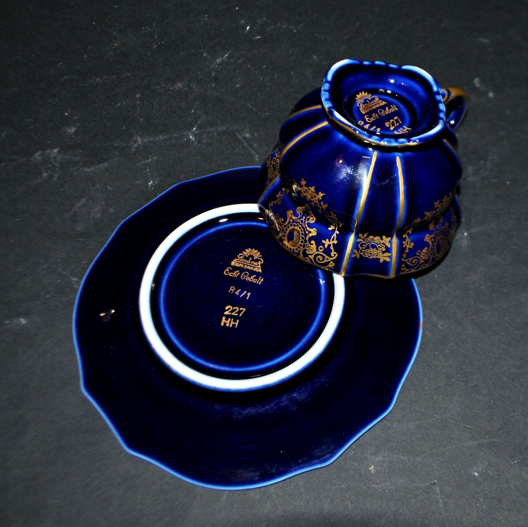 A precious, multi-lobed cup in German cobalt porcelain with a gold interior, Lindner Bavaria.