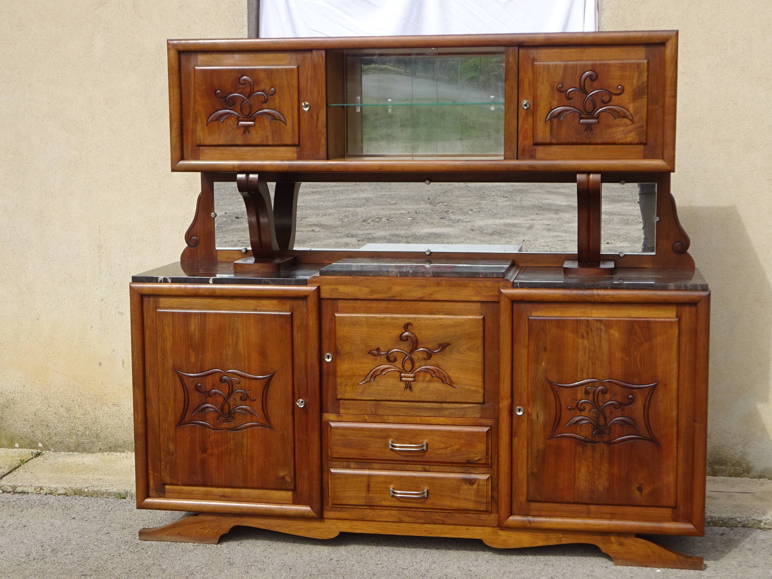 Solid walnut sideboard, moustache legs, black marble top.