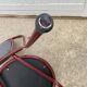 Metallic burgundy bistro chair for restaurants and communities with gray fabric