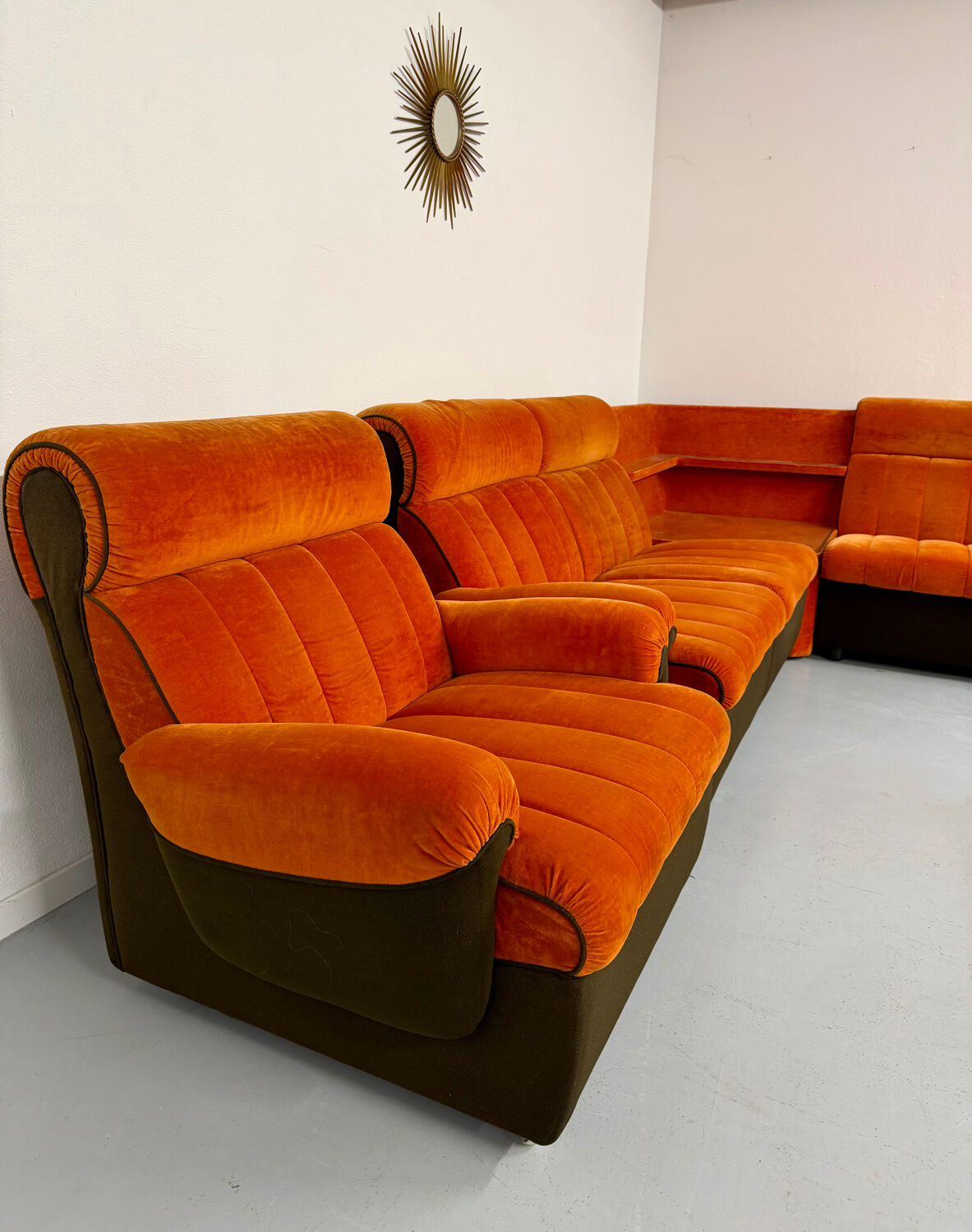 Modular vintage orange corner sofa, 1970s pop design.