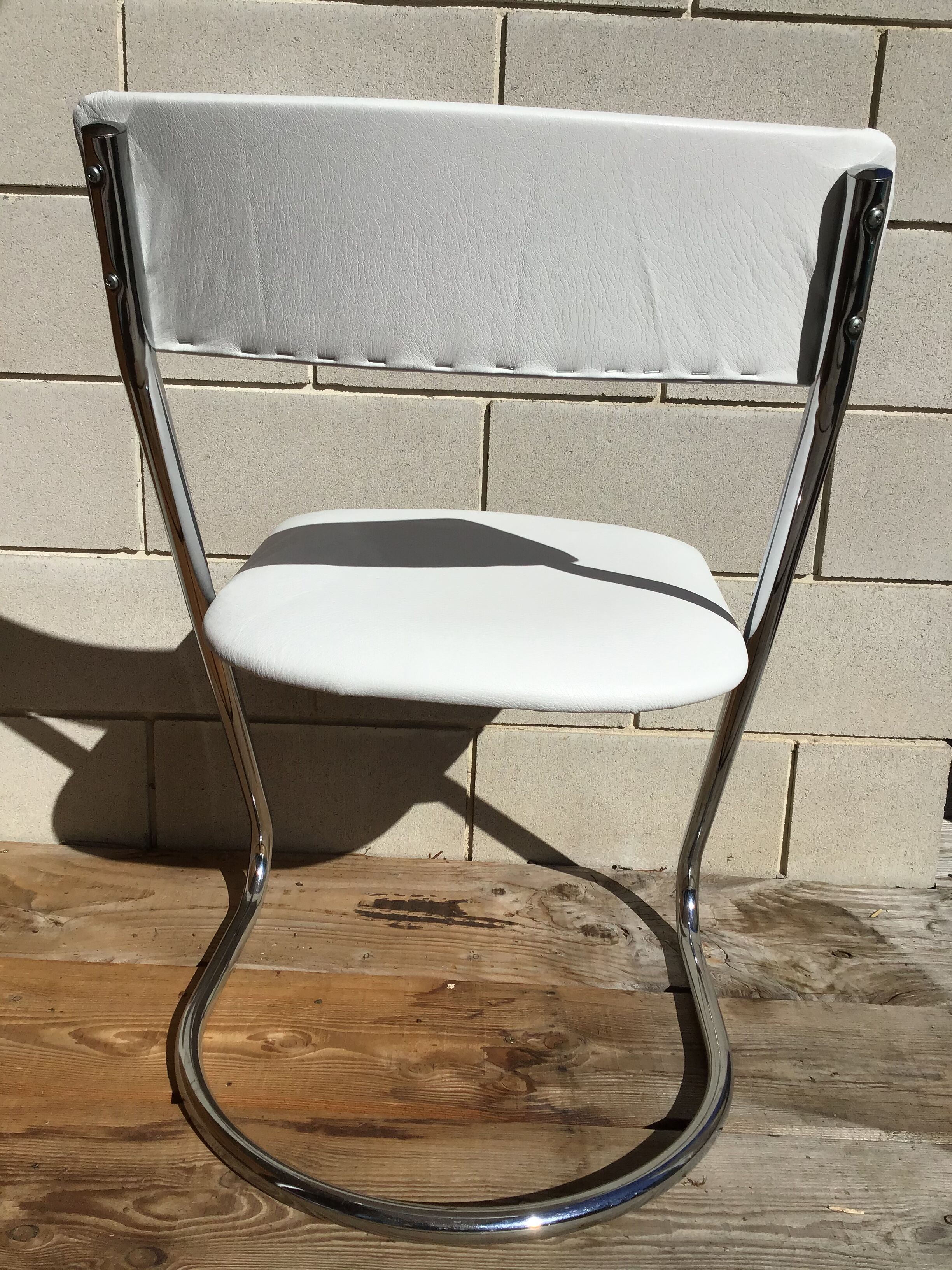 White faux leather sled chair