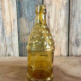 Bouteille 70s en verre jaune