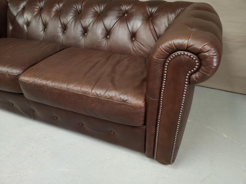 Three seater brown leather chesterfield sofa
