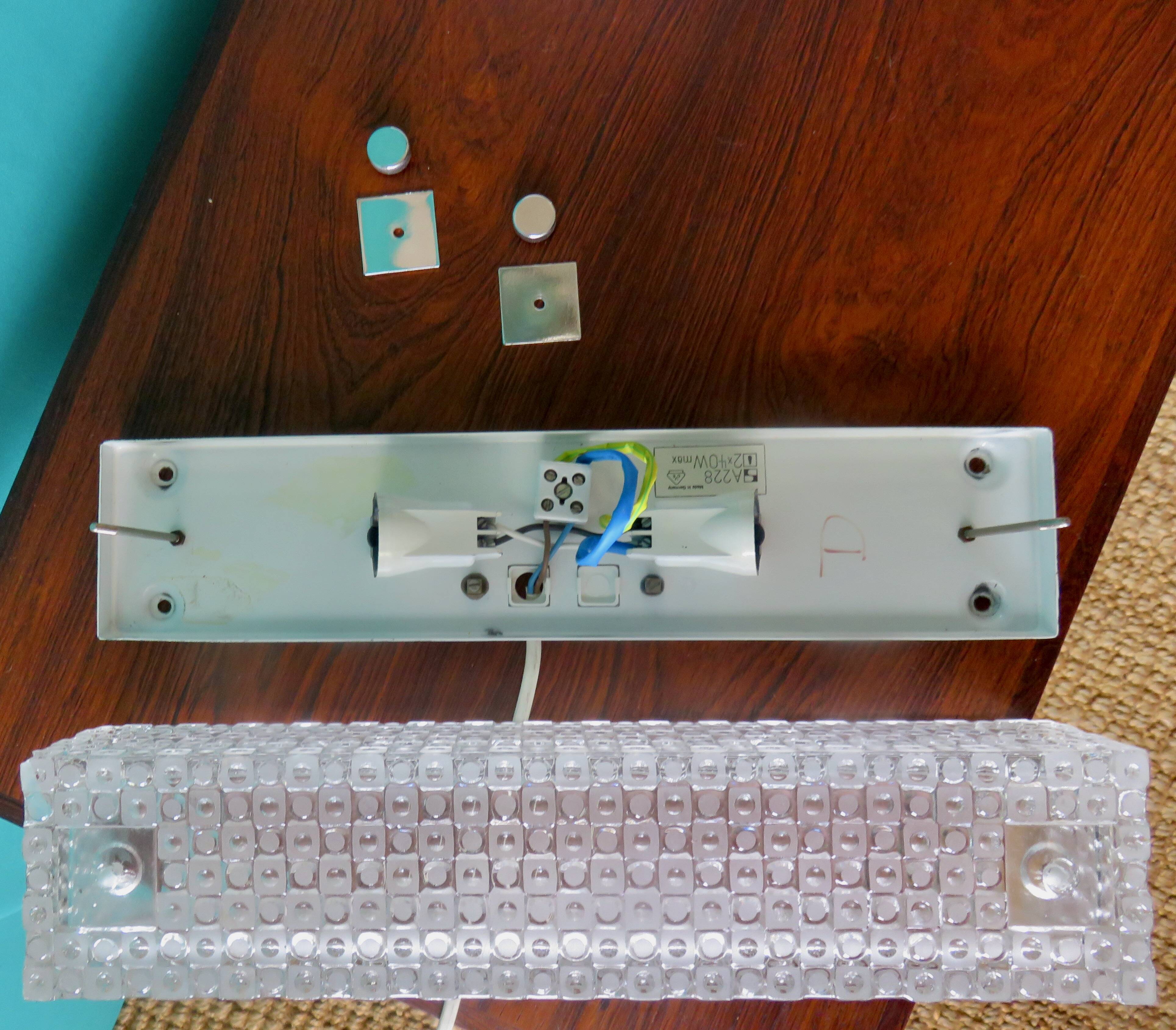 Pair of rectangular wall lights and square low relief glass wall lights. DVE Germany 1970