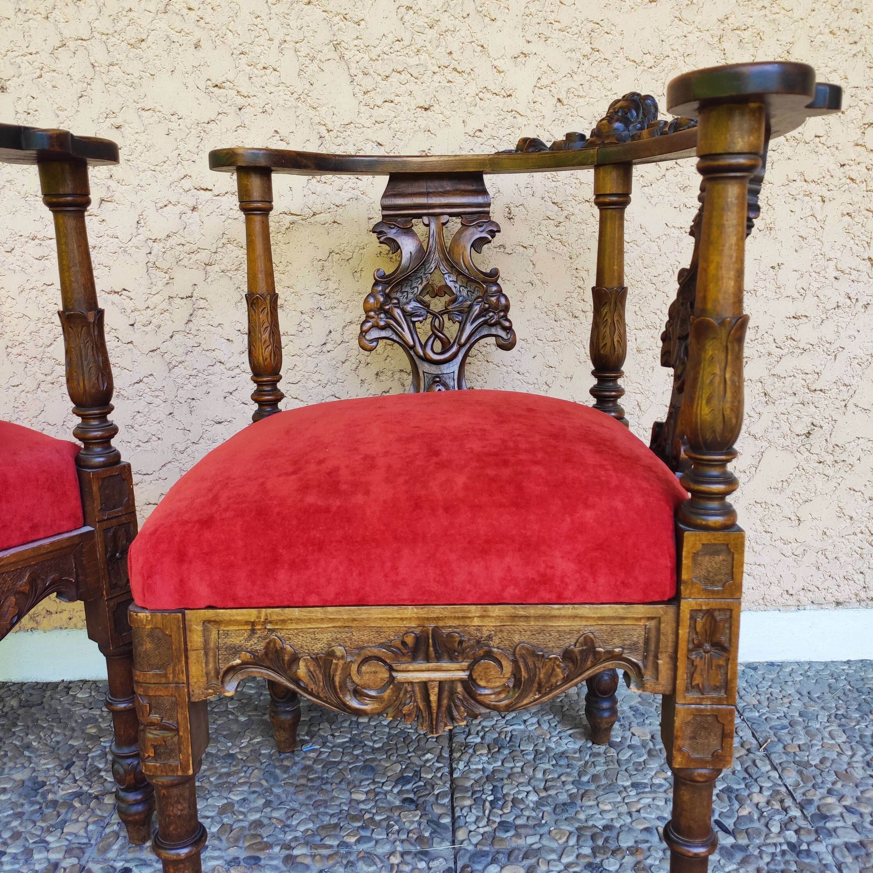 Pair of neo-Renaissance Henri II corner armchairs in carved wood, 19th century.