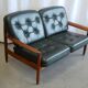 Scandinavian sofa in teak and green leather