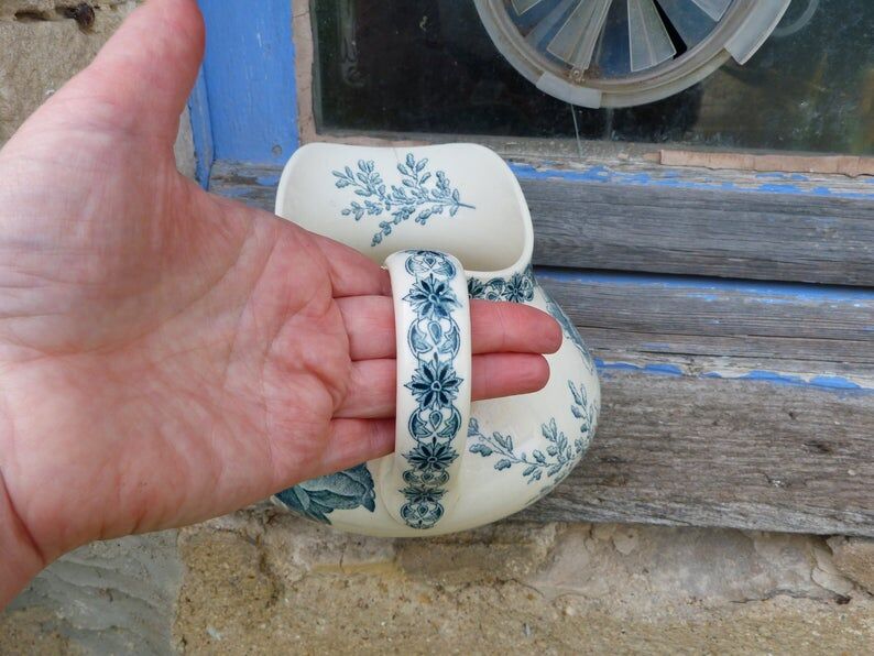 Jug in faience motifs flowers and insects