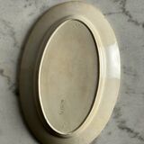 Oval blue presentation plate with birds.