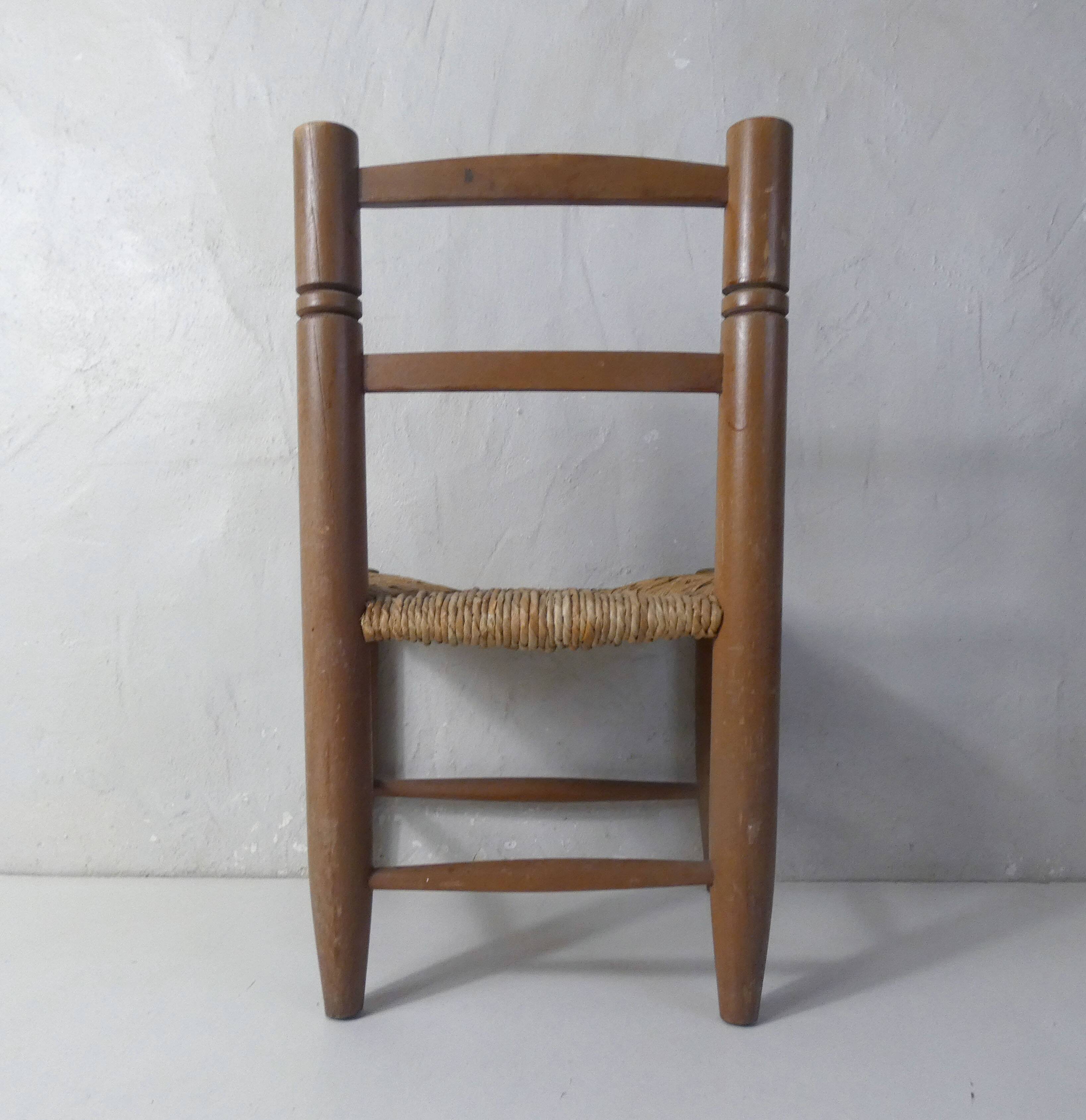 Old wooden straw chair for children