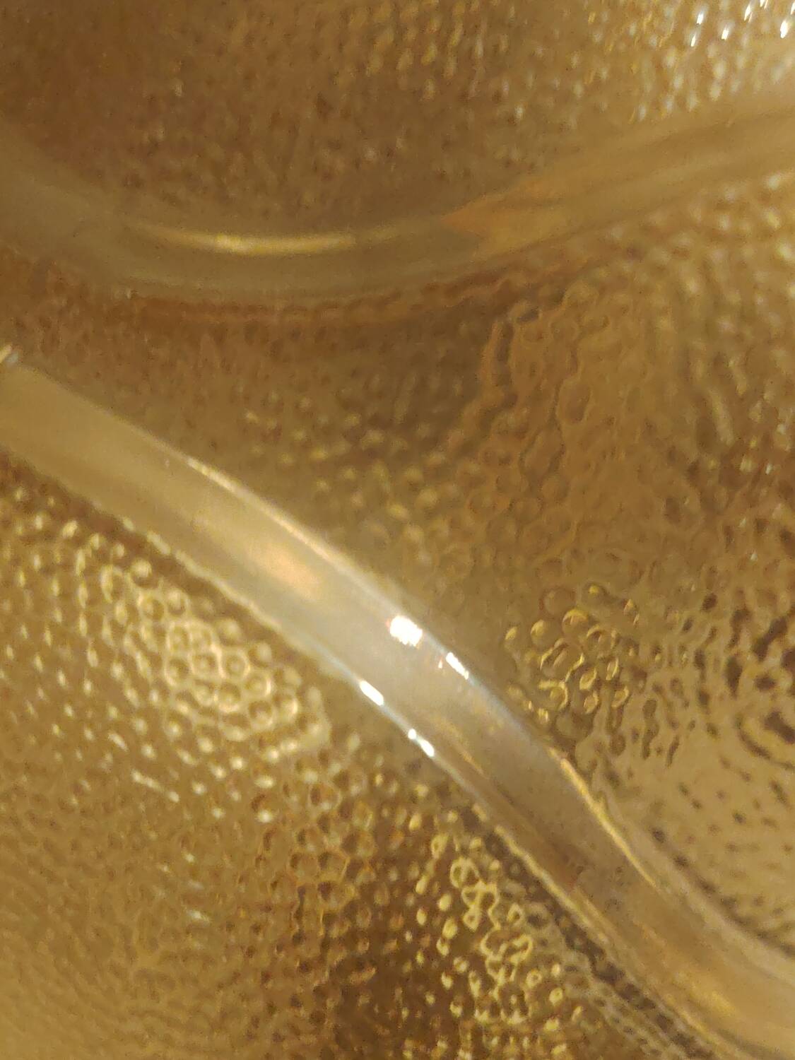 Textured amber globe wall light