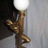 Lamp depicting a with a drape