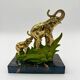 Art Deco bookends with elephants in brass and marble.