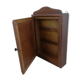 Wooden key box with botanical illustration.