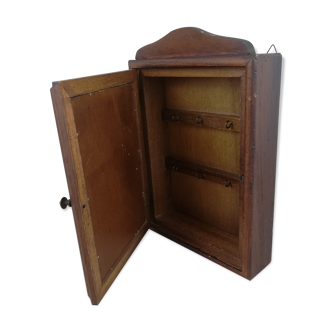 Wooden key box with botanical illustration.
