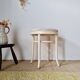 Vintage curved wooden stool in Baumann style, striped fabric seat.