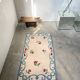 Tapis en laine blanc et bleu fleuri