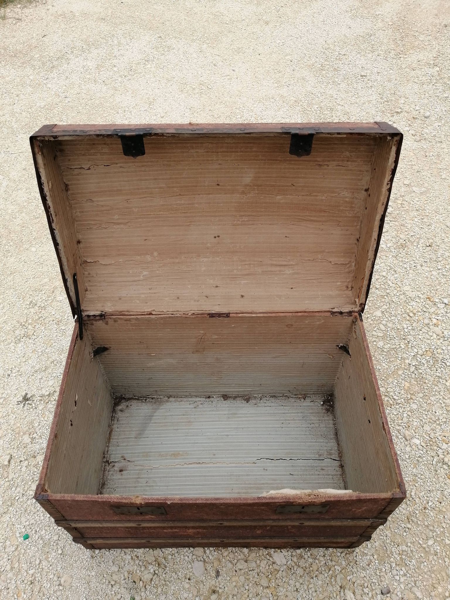 Old bombed travel trunk