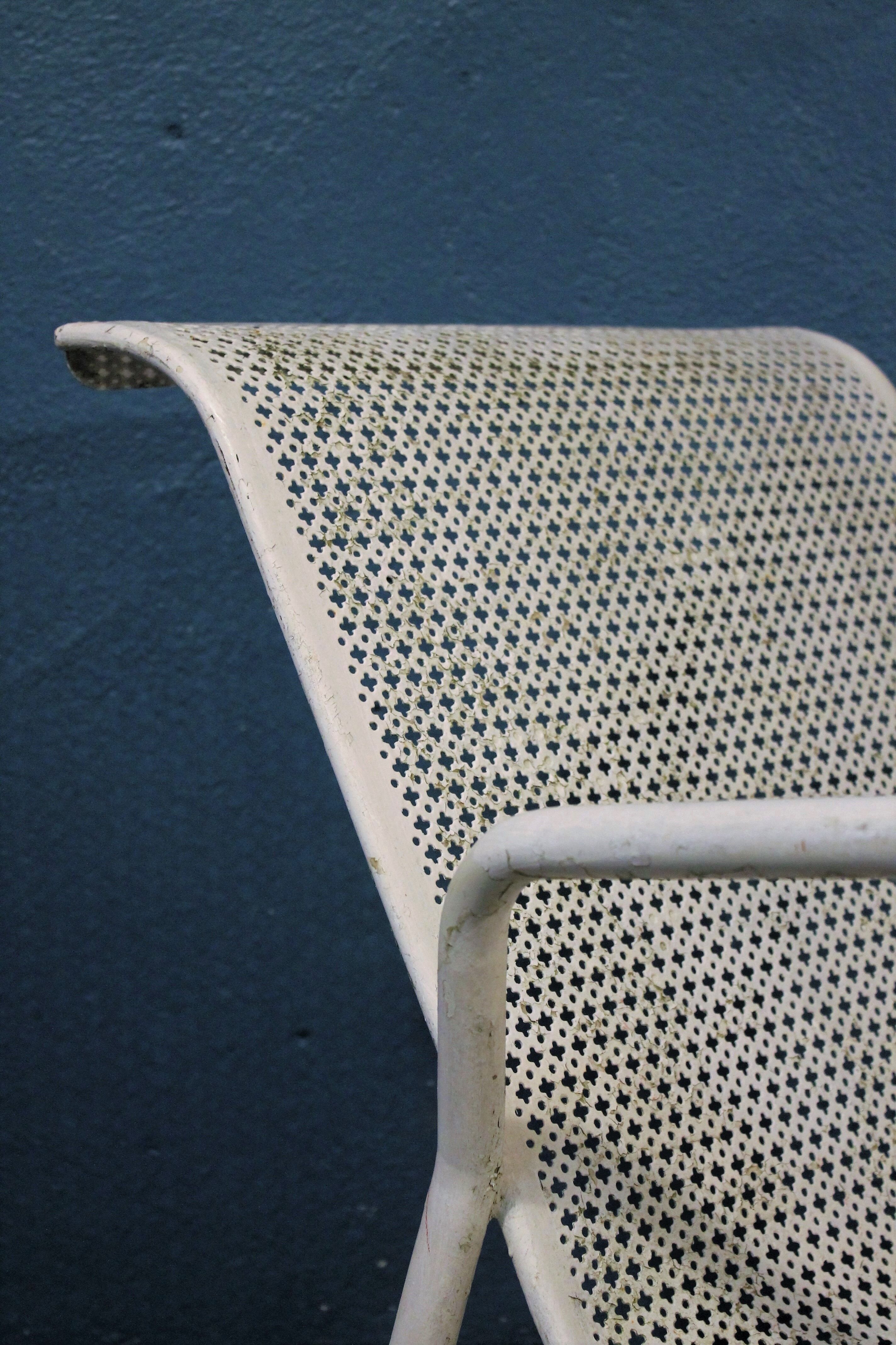 1960 perforated metal garden armchairs