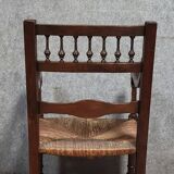 Renaissance-style armchair in solid wood, featuring a columned back