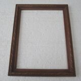 Wooden frame decorated with ribbon and flowers