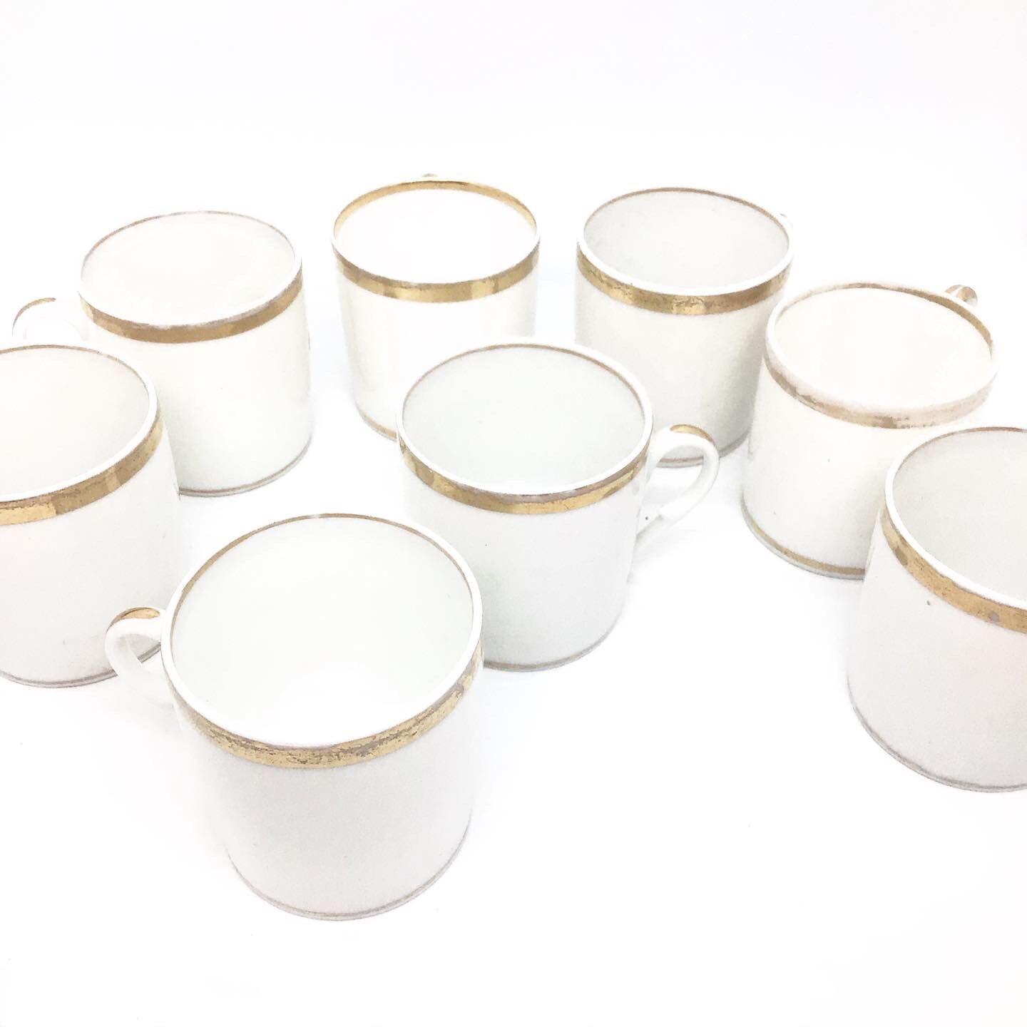 Lot of eight coffee cups and under cups