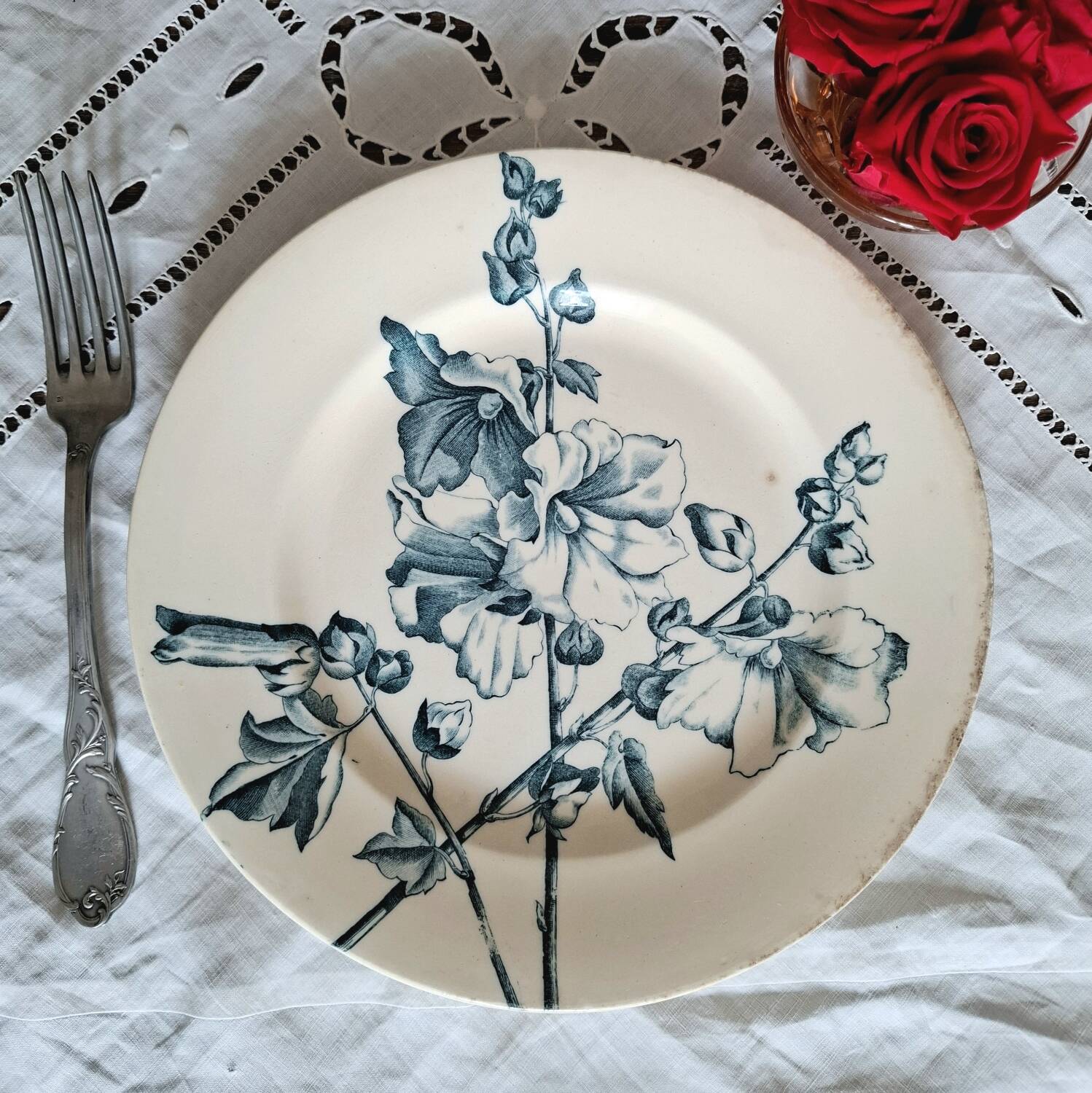 Old mismatched flat plates in iron earth earthenware accompanied by a dish