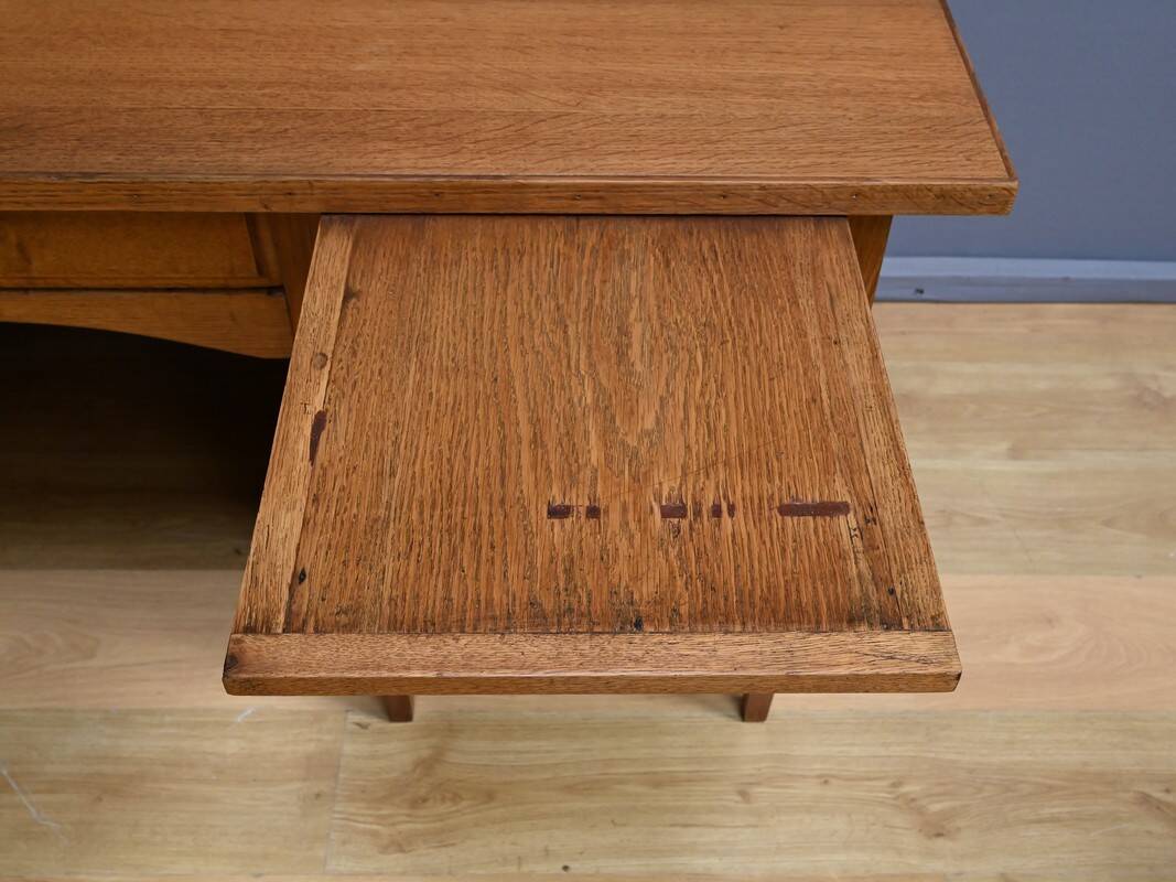Solid oak pedestal desk, Régy establishments – 1940