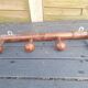 Old wooden coat hook imitating bamboo.