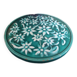 Dessous de plat vert à fleurs