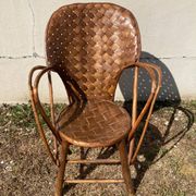 Vintage 1970s armchair in curved woven chestnut + seat cushion