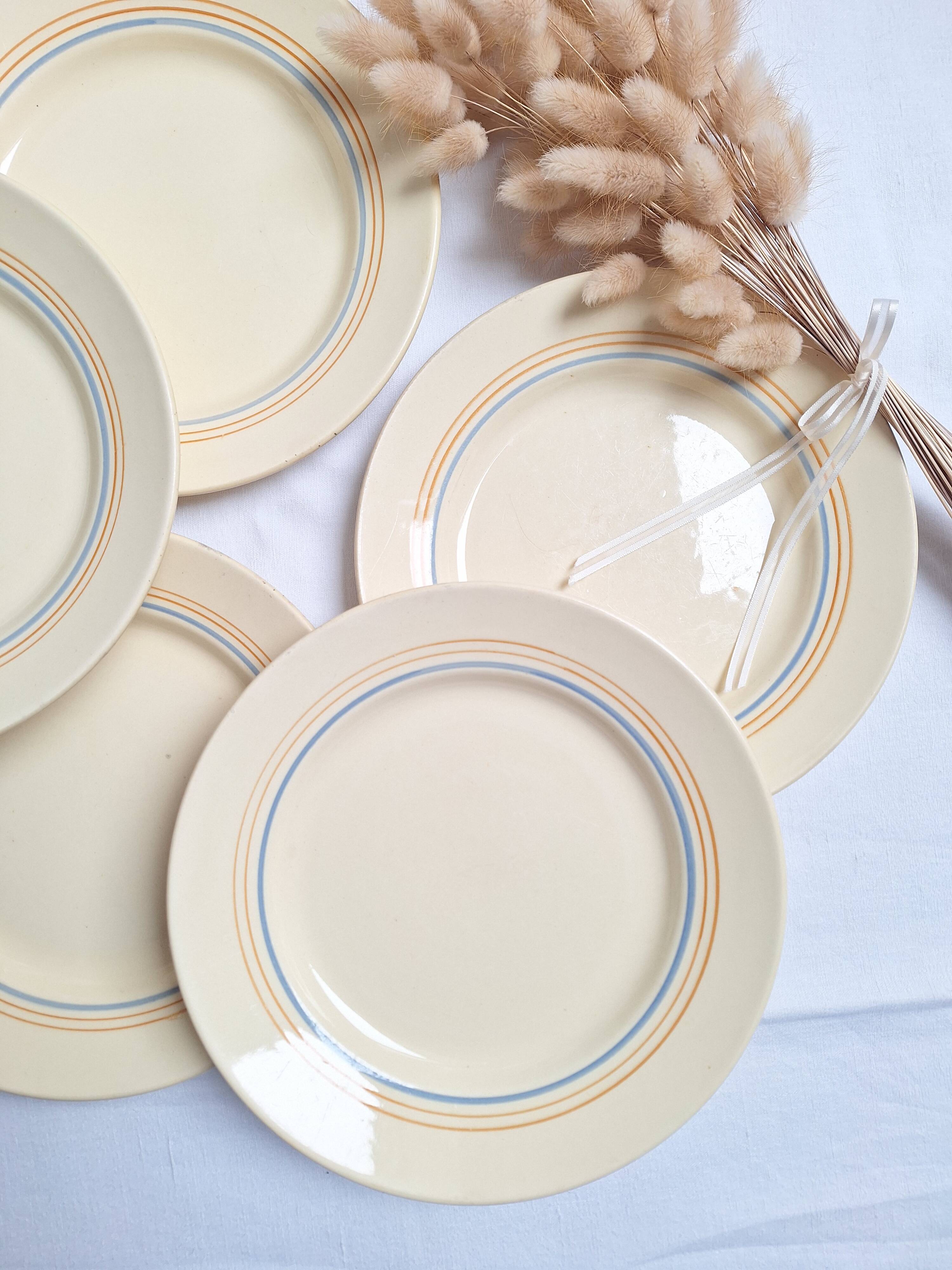 Vintage cream, orange and blue dinner plates.